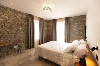 Letto o letti in una camera di Villa Antonietta Toscana Lunigiana piscina privata