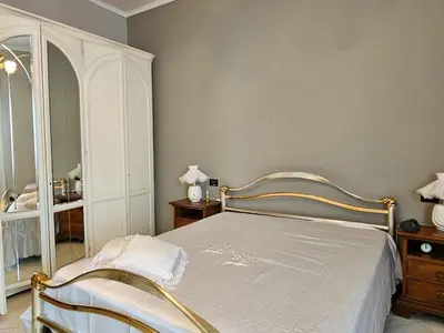 Letto o letti in una camera di Casa Orchidea a La Spezia