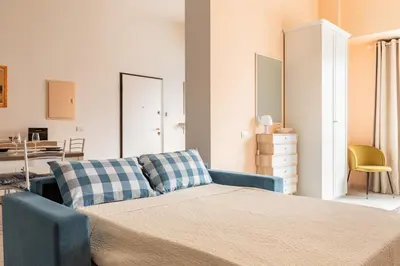 Letto o letti in una camera di Open Space a 1' dalla Stazione