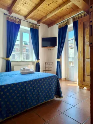 Letto o letti in una camera di Villa Luisa