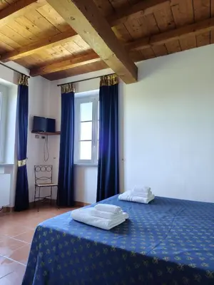 Letto o letti in una camera di Villa Luisa