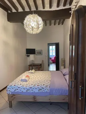 Letto o letti in una camera di Bilocale Inzani