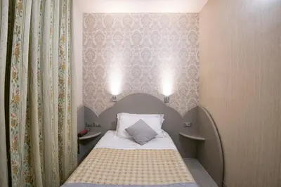 Letto o letti in una camera di Marchi Hotel