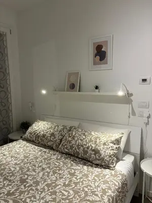 Letto o letti in una camera di SUITE NAVIGLIO 26