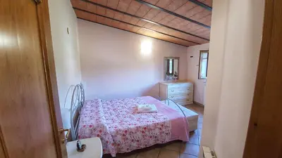 Letto o letti in una camera di Spicchio di Luna - Casa Vacanze