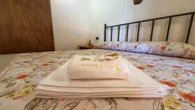 Letto o letti in una camera di Spicchio di Luna - Casa Vacanze