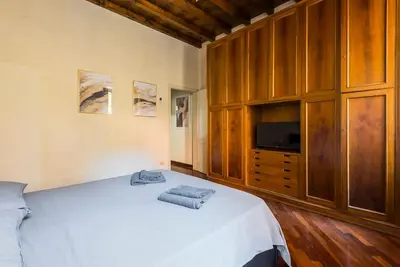 Letto o letti in una camera di [Vista sulla Basilica]