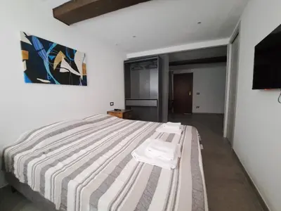 Letto o letti in una camera di Alloggiamo