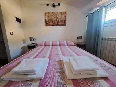 Letto o letti in una camera di Alloggiamo