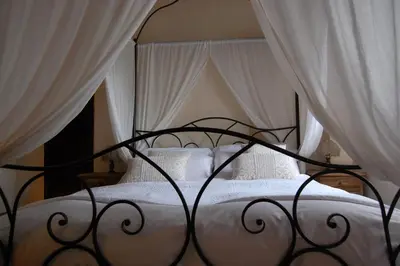 Letto o letti in una camera di Torre del Barbagianni - Castello di Gropparello