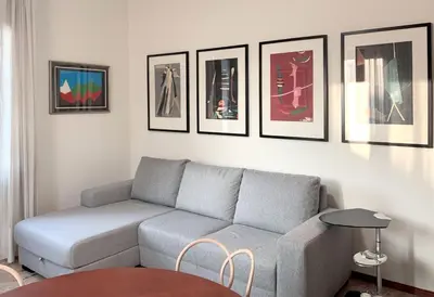 Area soggiorno di Mini Suite Cremona
