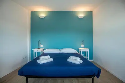 Letto o letti in una camera di 100b - VILLA Ginestra, ampia Terrazza 120m2 vista mare, 3 camere da letto