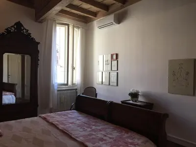 Letto o letti in una camera di B&B L'Affresco