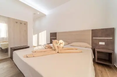 Letto o letti in una camera di Mentana Rooms