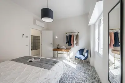Letto o letti in una camera di Altalena sulla piazza, un affaccio d'eccezione