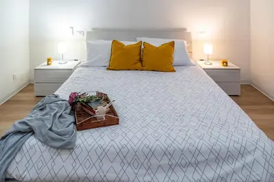 Letto o letti in una camera di Casa Golgi - Pavia City - by Host4U