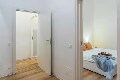 Letto o letti in una camera di Casa Golgi - Pavia City - by Host4U