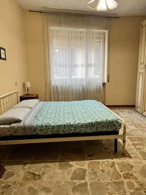 Letto o letti in una camera di Casa Luna