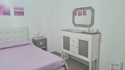 Letto o letti in una camera di Tana della Lavanda