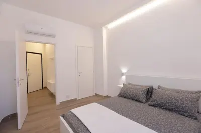 Letto o letti in una camera di Casa Teresitta a un passo dalla Baia del Silenzio
