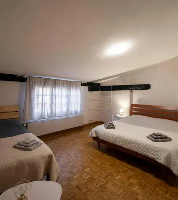 Letto o letti in una camera di Via Verdi LOFT