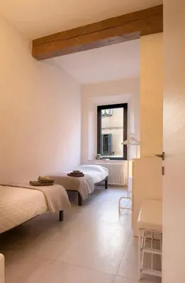 Letto o letti in una camera di Via Verdi SUITE