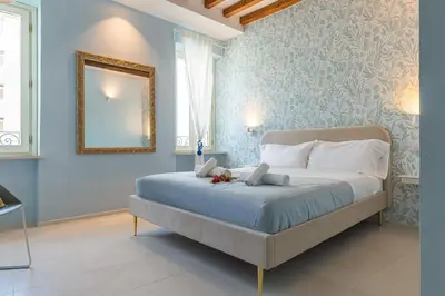 Letto o letti in una camera di GLAM PARMA
