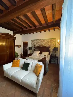 Letto o letti in una camera di B&B Villa la Canonica con piscina a Padernello