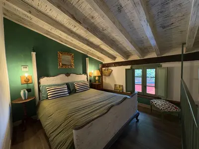 Letto o letti in una camera di B&B Villa la Canonica con piscina a Padernello