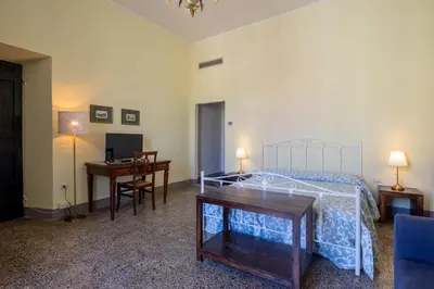 Letto o letti in una camera di MATTEOTTI ROOMS