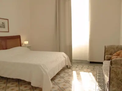 Letto o letti in una camera di Residenza Cavour - Appartamento AGAVE