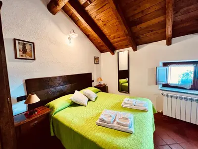 Letto o letti in una camera di Agriturismo Montagna Verde Apella
