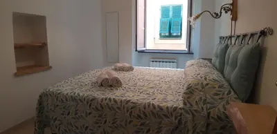 Letto o letti in una camera di 2 appartamenti totale 12 posti letto