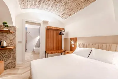 Letto o letti in una camera di Parco Ducale Design Rooms