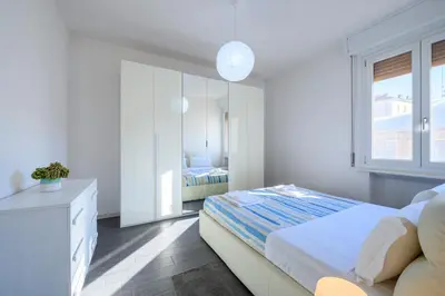 Letto o letti in una camera di GuestHost - Parma Station & City Center Apartment