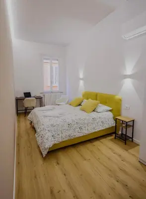 Letto o letti in una camera di Feltrinelli Suite