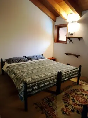 Letto o letti in una camera di Cascina Amrit CAV