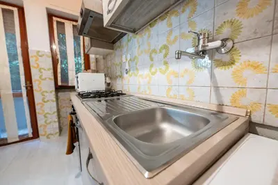 Cucina o angolo cottura di 228 - Casa Guarda Stelle - In Residence con Piscina e Aree esterne comuni a 1km dal Mare