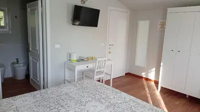 Letto o letti in una camera di Caterina e l'Indaco