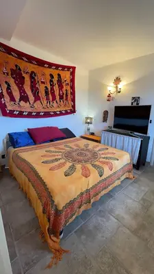 Letto o letti in una camera di Magico Appartamento e Tramonti in Terrazza Vista Mare in Liguria, 6 posti letto
