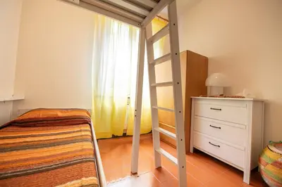 Letto o letti in una camera di 182 - Casa degli Ulivi Cavi di Lavagna, 50metri dal mare e dalle spiagge