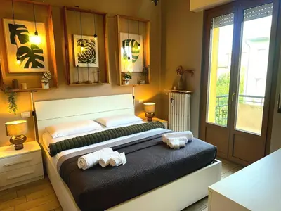 Letto o letti in una camera di APPARTAMENTO CREMONA FIERA