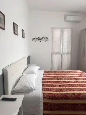 Letto o letti in una camera di ALO ALO ALBERGO