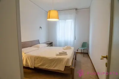 Letto o letti in una camera di FuoriPorta Affitti Brevi - Borgo Maria Luigia