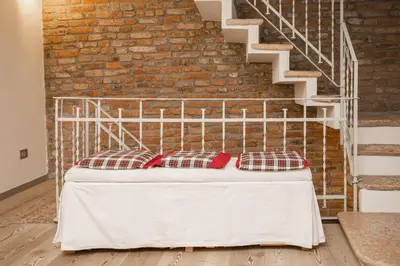 Letto o letti in una camera di Casa del Sarto