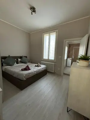 Letto o letti in una camera di Maison del Ducato Suite Parmigianino