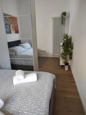 Letto o letti in una camera di KAIROS RESIDENCE