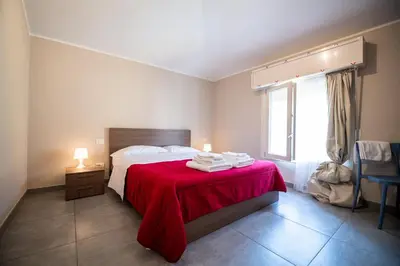 Letto o letti in una camera di Porta Galileo l Comfort Rooms & Parking