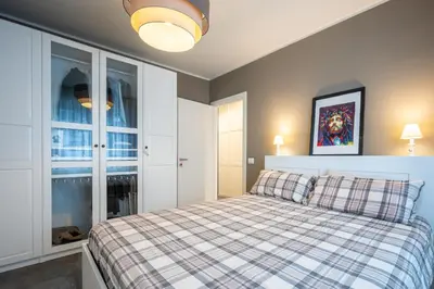 Letto o letti in una camera di GuestHost - Parma Elegant and Sweet Apartments