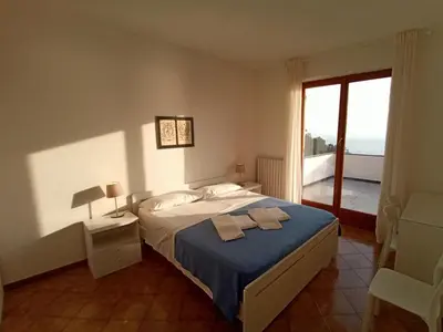 Letto o letti in una camera di Casa Orchidea - Vista Mare meravigliosa